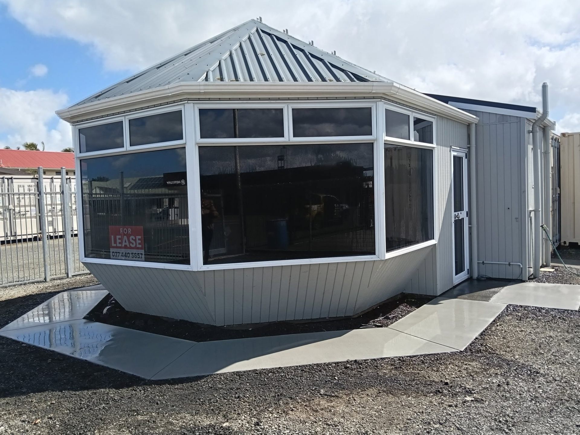 Concrete footpath wrapping around a building by Henwood Concrete
